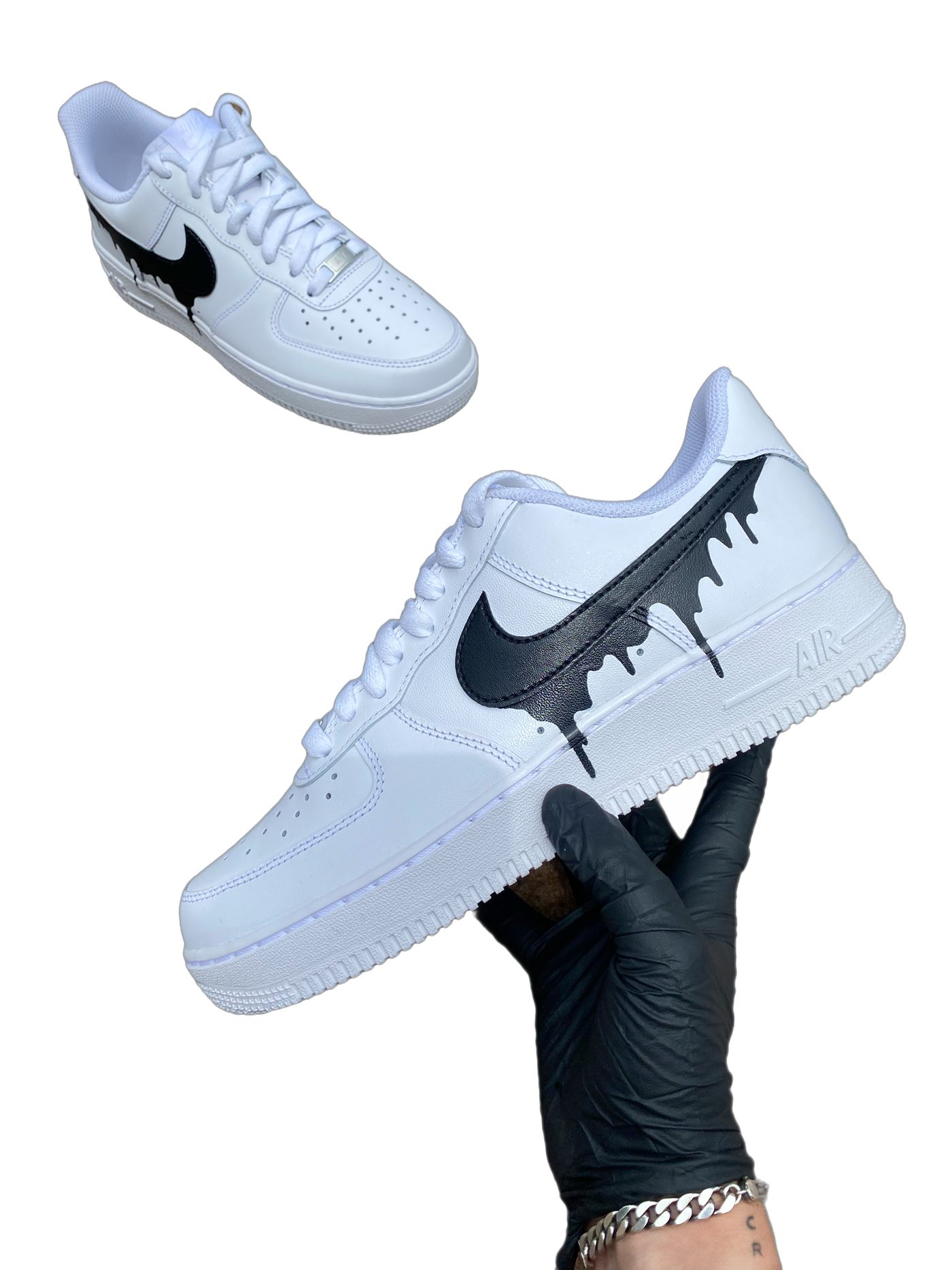 White sneakers with a black drip design