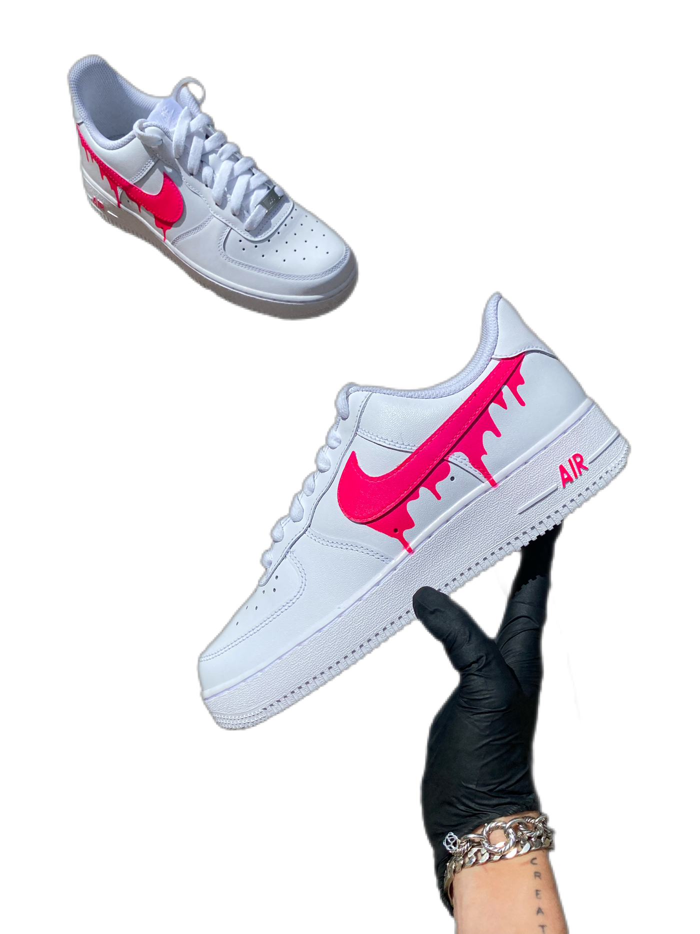 White sneakers with a hot pink drip design