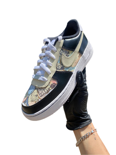 Black and beige colored sneakers with fake money design 