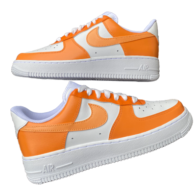 Two hand-painted orange colorway Air Force 1's.  They are laying down. There are 3 shades of orange worked into the colorway. Angle 3.