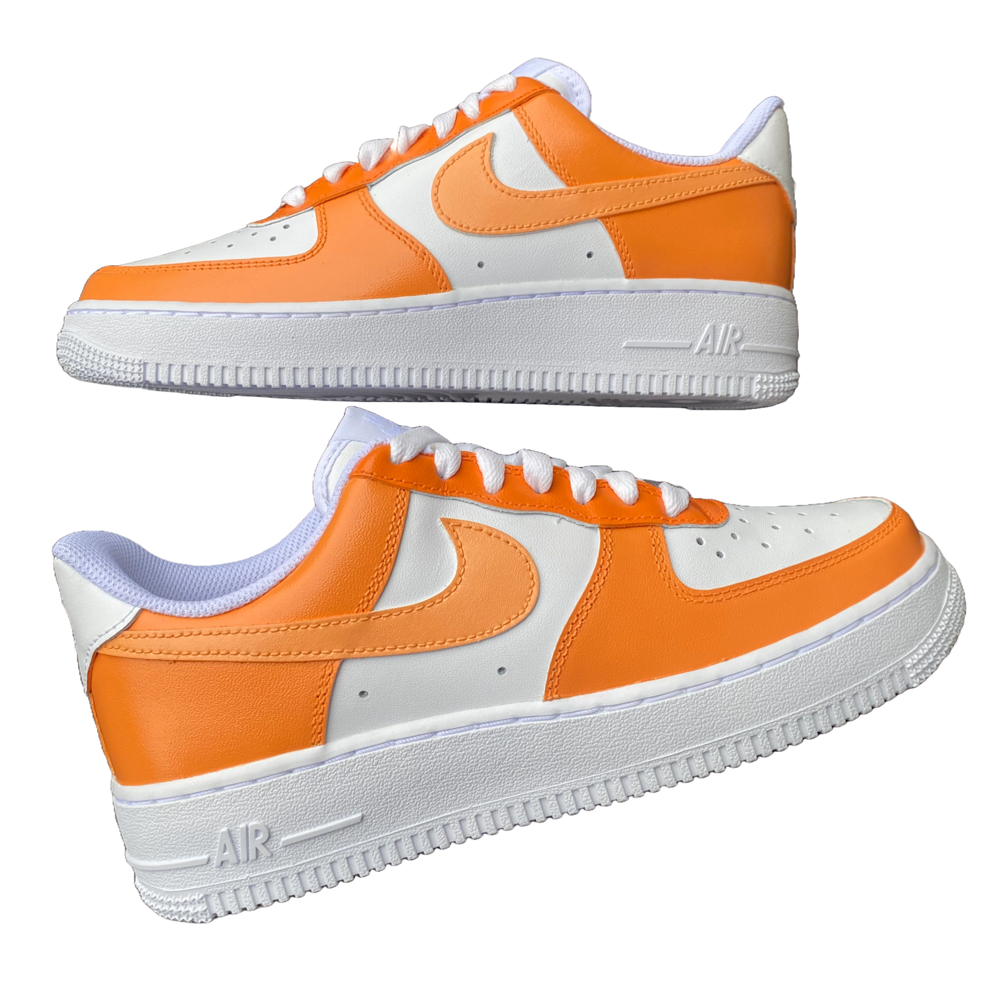 Two hand-painted orange colorway Air Force 1's.  They are laying down. There are 3 shades of orange worked into the colorway. Angle 3.